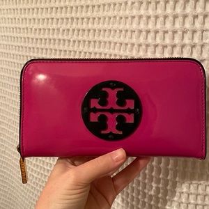 Tory Burch pink patent leather wallet. Some wear. Shown in pictures